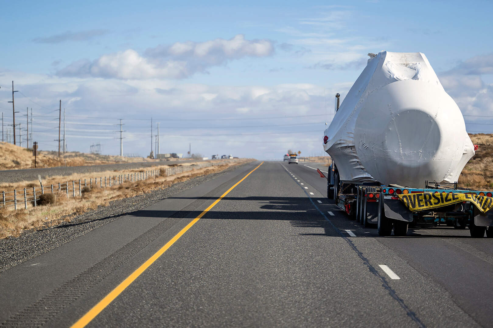 truck on desert highway carrying specialized freight